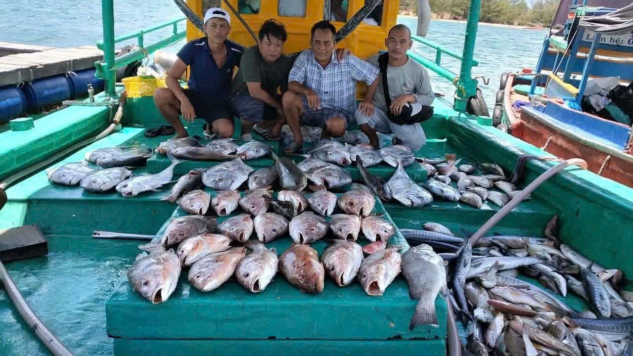 Guest on deck during a first offshore fishing trip from Nha Trang